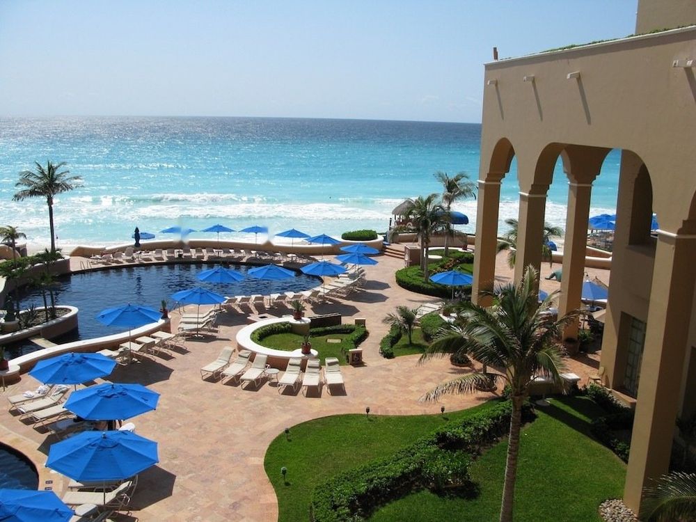 The hotel’s pool terrace and beach (photo from its Ritz-Carlton years)